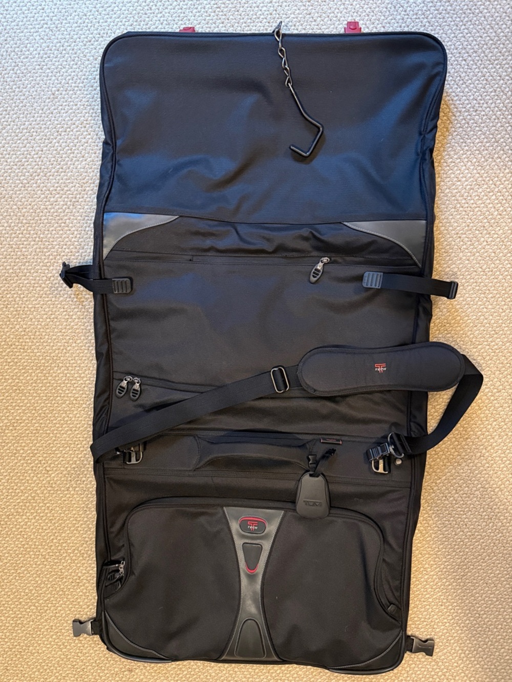 Tumi Tech Black TriFold lightweight Garment Bag with Adjustable Shoulder Strap.